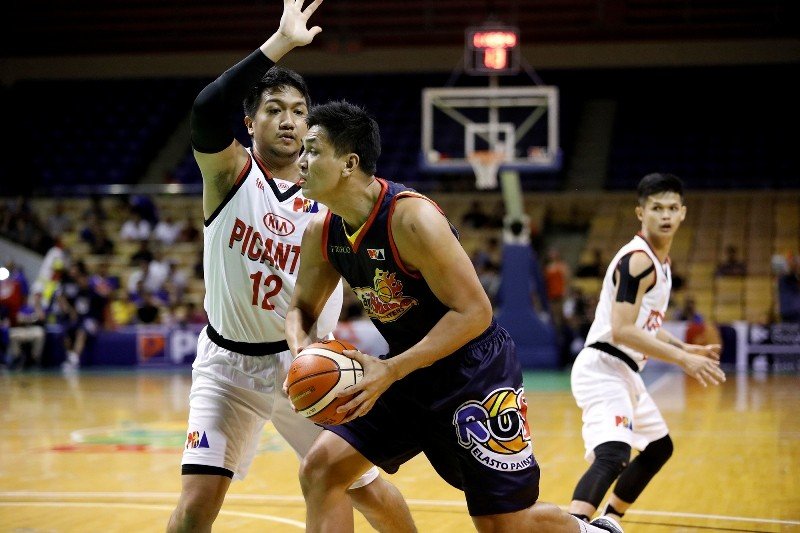Prince Caperal (12) guards Jewel Ponferada of the Rain or Shine Elasto Painters. Caperal is now a member of Barangay Ginebra. (PBA Images)