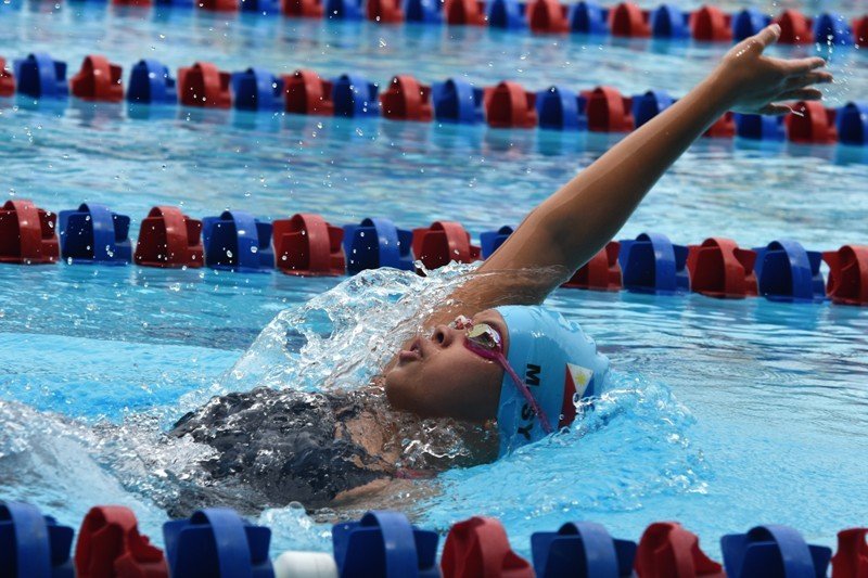 Mishka Sy  shows winning form on the way to victory in the girls 13-under 200-meter backstroke in the 42nd SEA Age Group Swimming Championships at the Trace Aquatics Center in Los Banos Laguna.    