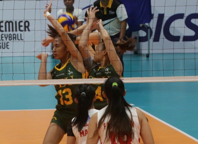 FEU’s Celine Domingo and Heather Anne Guino-o struggle trying to keep the ball in play as San Beda’s Aurea Racraquin (18) and Lynne Matias (partly hidden) look on.