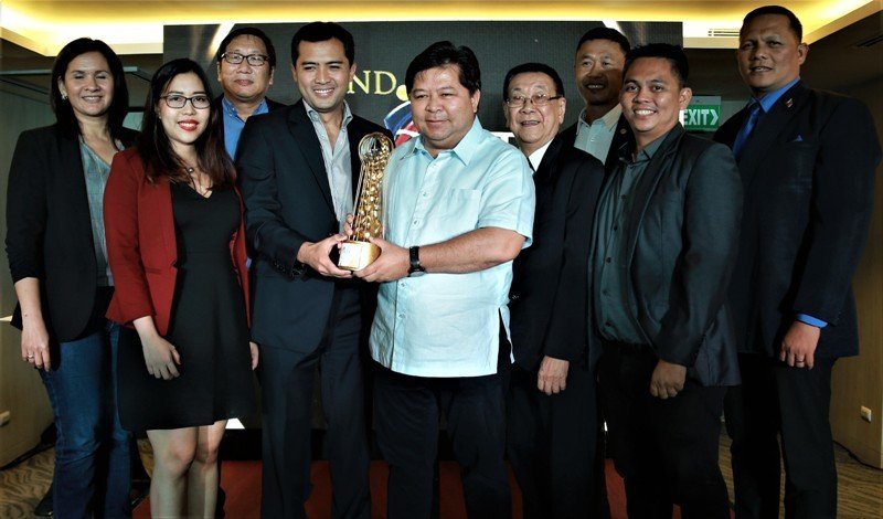 In photo are Mayor Remollo (center), along with the city officials and department heads, receiving the award with DOT Central Visayas regional director Shalimar Hoffer Tamano.