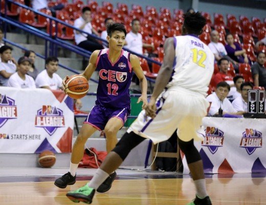 Jerome Santos of CEU guarded by Mohammad Pare of St. Clare College (PBA Images)
