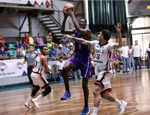 Malick Diouf of CEU is challenged by Jaypee Belencion of iWalk. (PBA Images)