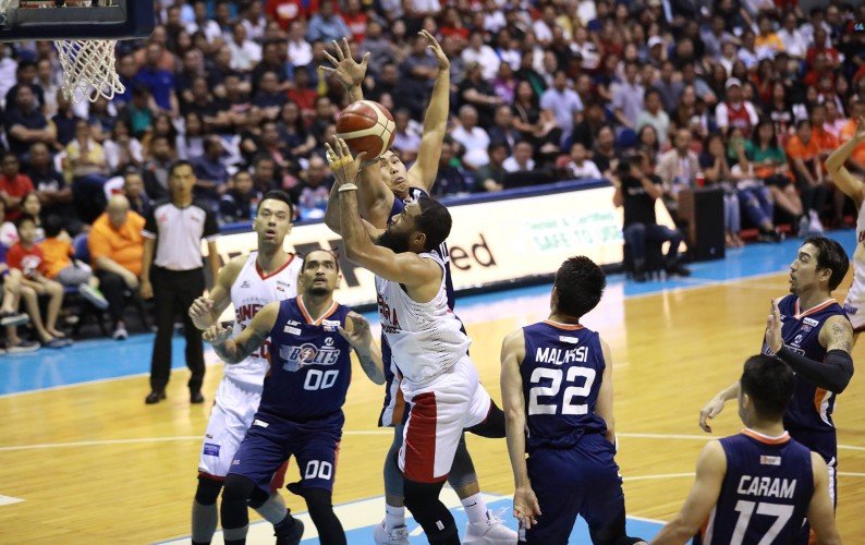 Stanley Pringle of Barangay Ginebra goes up for a shot against John Pinto of the Meralco Bolts in the PBA PH Cup Finals. The Kings won to take a 2-1 series lead. (PBA Images) 