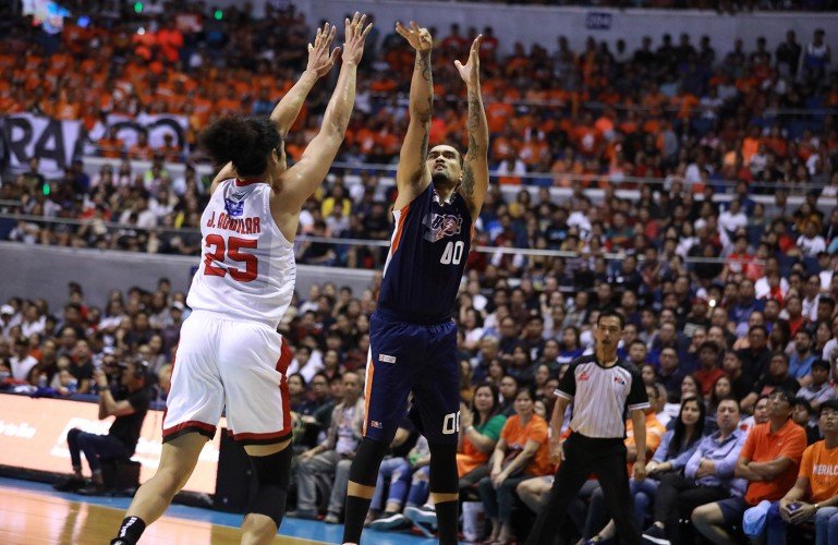 Bryan Faundo of the Meralco Bolts goes up for a shot against Japeth Aguilar of Barangay Ginebera. (PBA Images) 