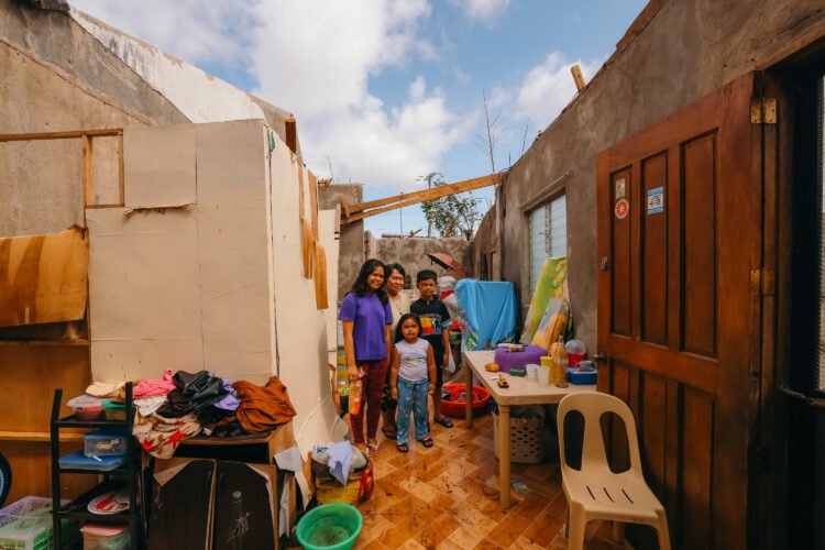 This is the house of Betty Consuega in the outskirts of the Surigao City Airport, roofless and dilapidated after the typhoon Odette hit the island. She is one of the 56,000 families that are displaced after the devastation made by the typhoon. Betty shielded her 3 grandson and daughters when the roof went off and prayed that her grandchildren are spared from the typhoon. [Jilson Tiu/Greenpeace]