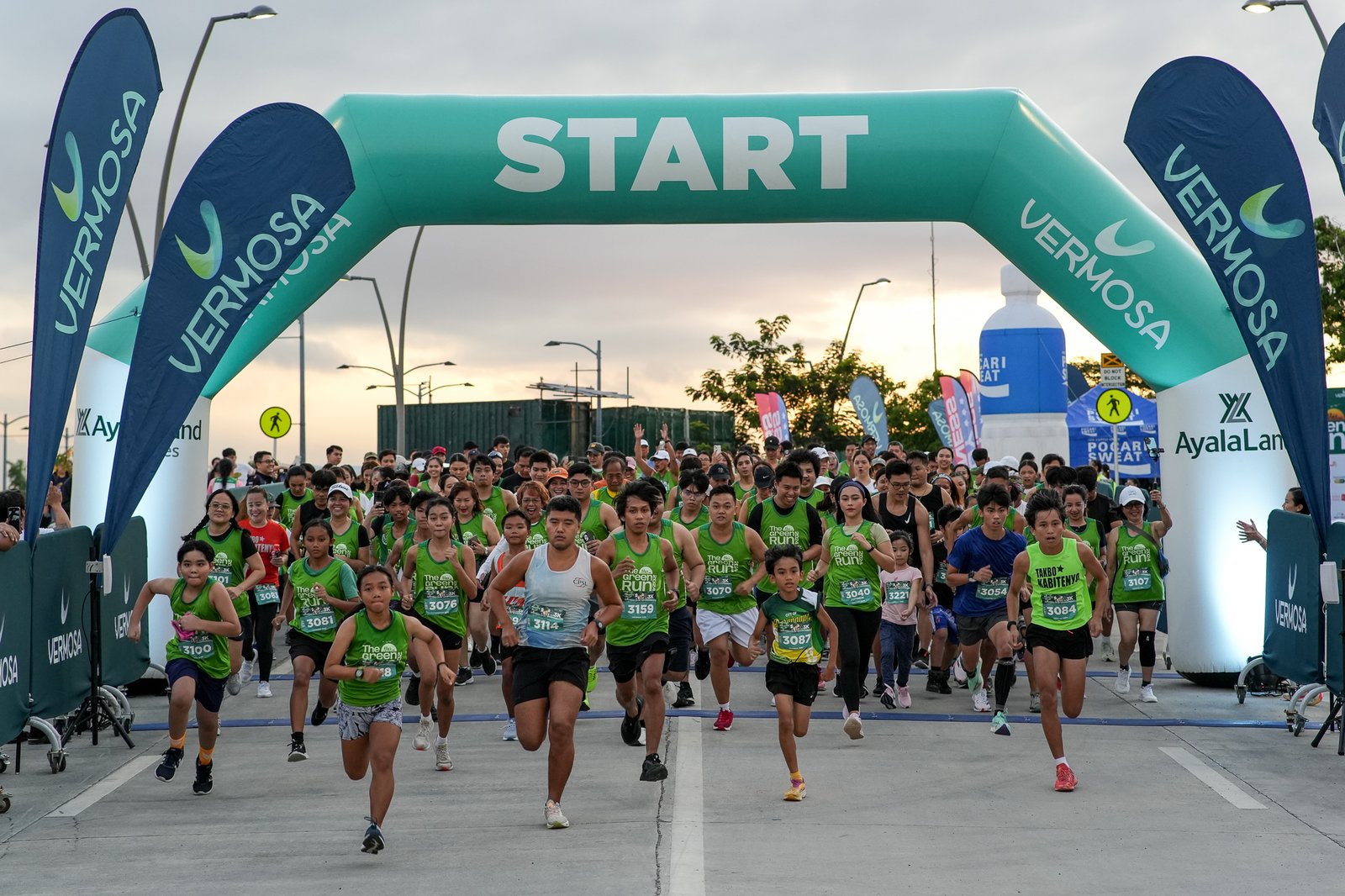 Runners race across Vermosa Estate during last year’s vibrant Green Run.