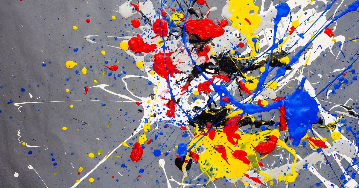 A abstract painting with a gray background. Splashes of white, red, yellow, black, and blue splatter across the canvas.