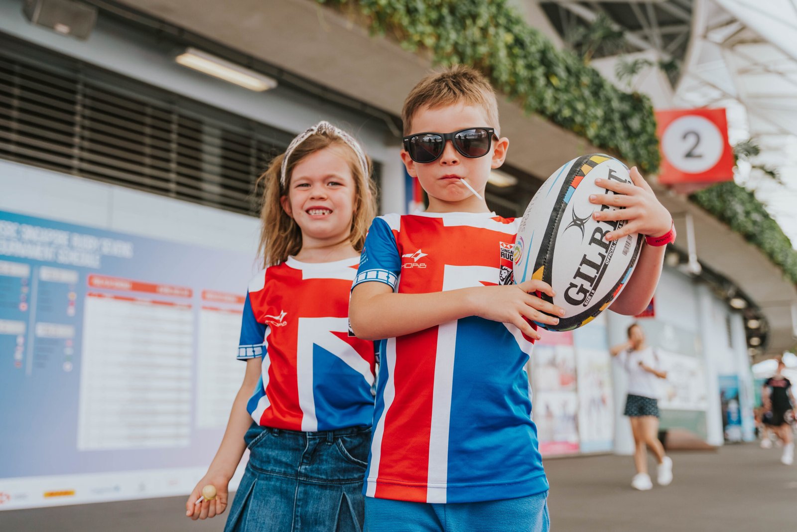 Kids try touch rugby activities at the fan engagement zones. [photo credit: The Kallang Group]
