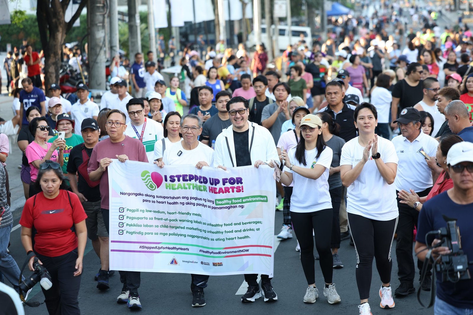 (From left to right) Akbayan Partylist Representatives Perci Cendaña and Chel Diokno, Quezon City Councilor Atty. Vincent Belmonte, Department of Health’s Angelica Palmero, and ImagineLaw Executive Director Atty. Sophia San Luis led the “Step Up for Healthier Hearts” march along Tomas Morato Avenue in Quezon City, rallying support for stronger food policies to protect Filipino families from heart disease and other diet-related diseases.