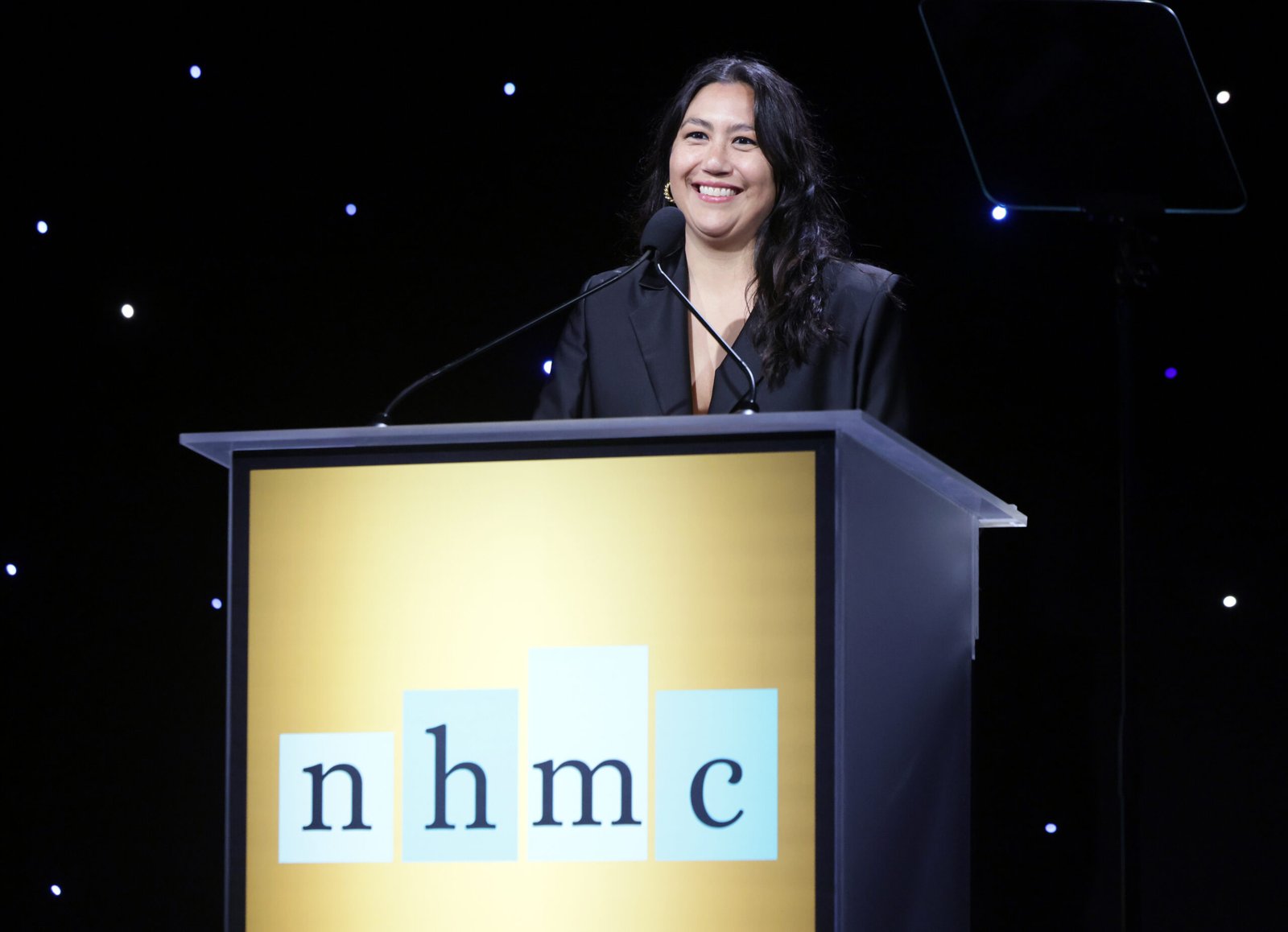 Beth de Araújo speaks on stage after receiving the Visionary Impact Award. (Photo by Rodin Eckenroth/Getty Images for National Hispanic Media Coalition) 