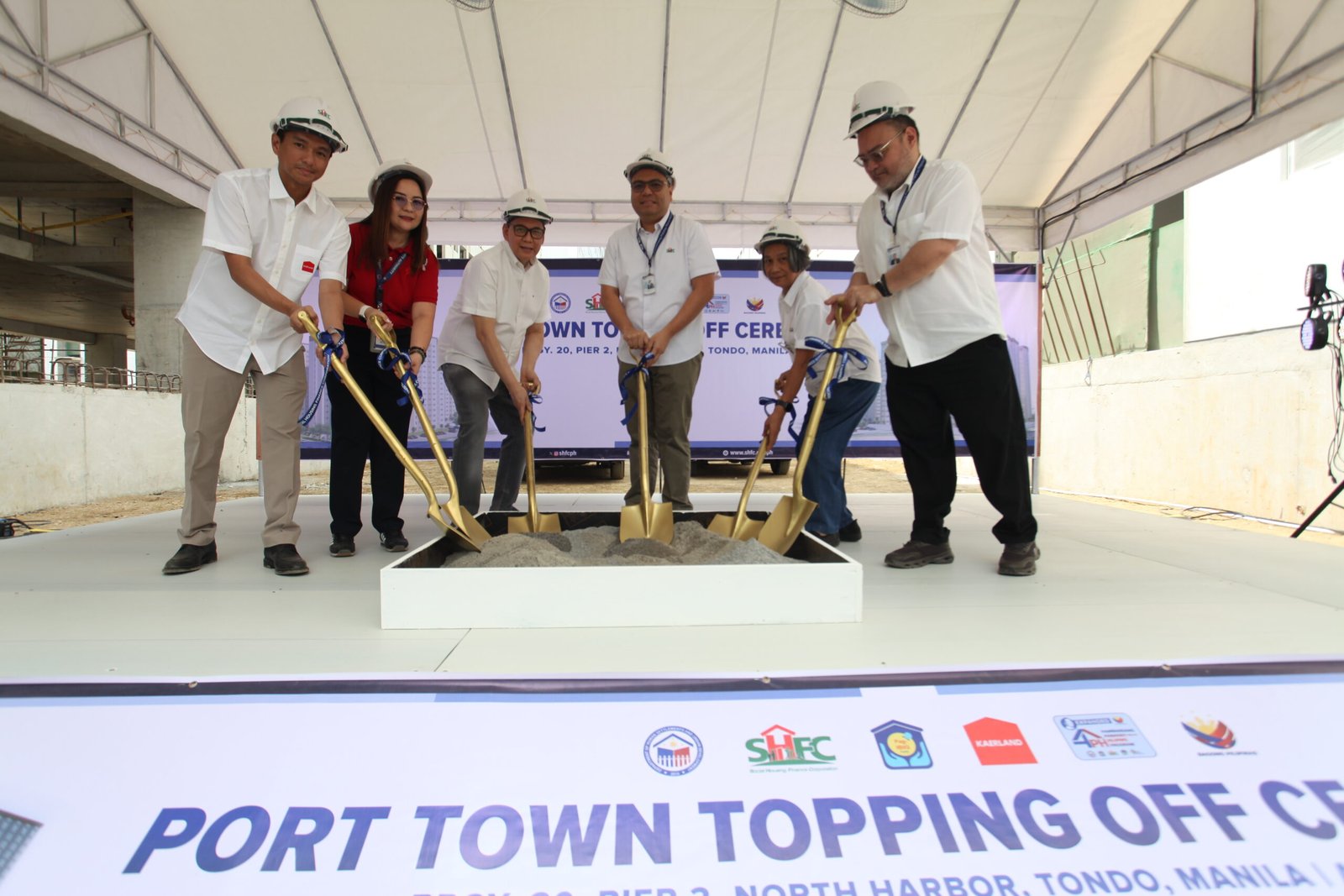 A major housing project in Tondo has reached its topping-off stage as government agencies push forward with vertical housing developments.
