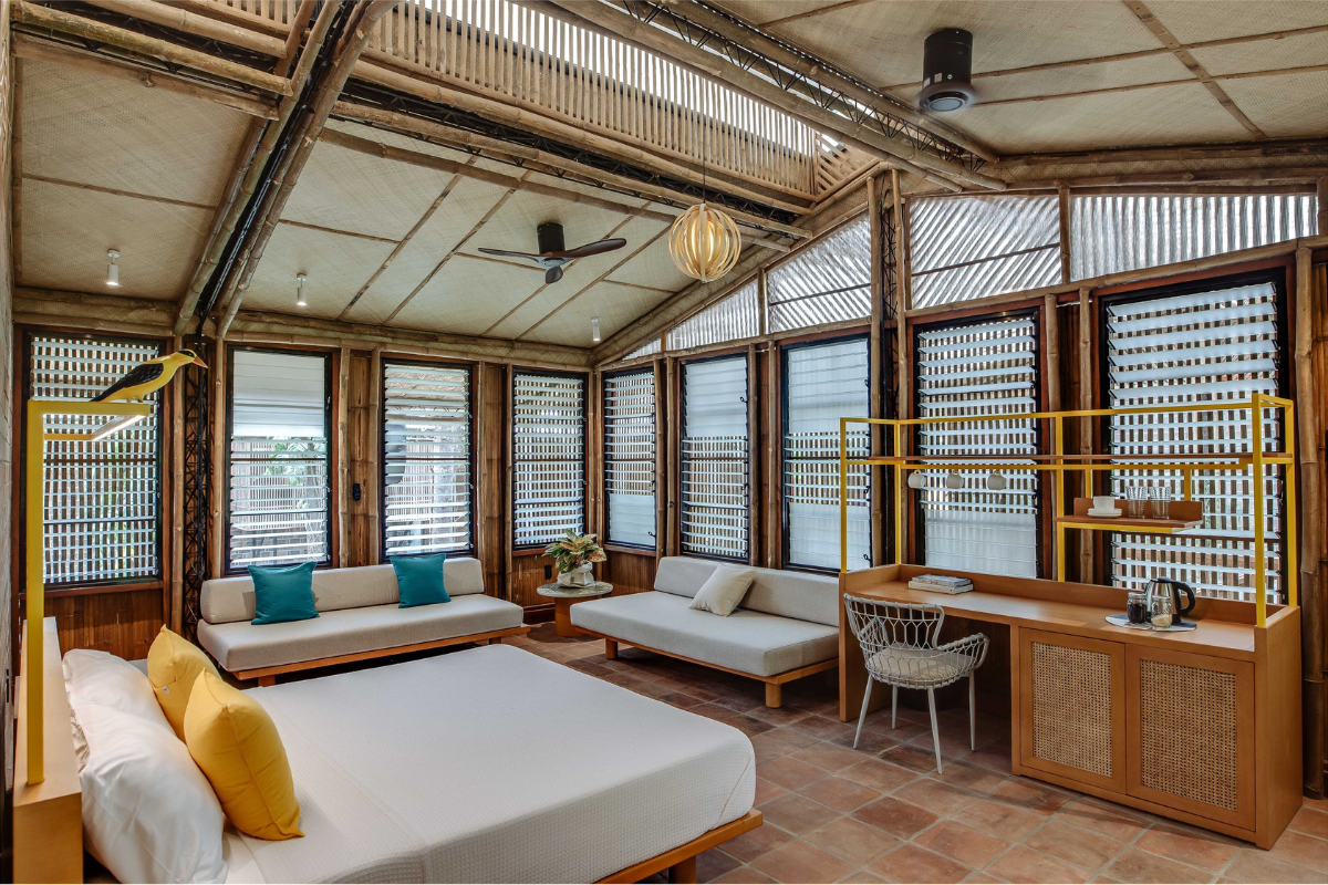 Designed by Dominic Galicia Architects, the resort's guest cabins feature woven bamboo ceilings, clay tiles, brick walls and reclaimed wood.