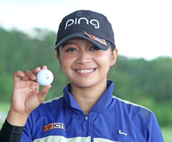 Princess Superal holds the ball after scoring an ace on No. 17