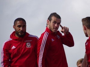 Gareth Bale with Ashley Williams (left) [photo credit: Jon Candy | Wikimedia Commons]