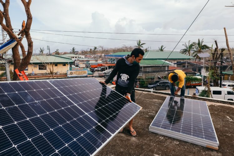 Greenpeace installs solar panels at the Incident Command Post for Surigao Del Norte’s Odette operations — Staff can charge more laptops, radio, phone, and other devices to aid their reporting and monitoring of Typhoon Odette. [photo credit: Jilson Tiu | Greenpeace]