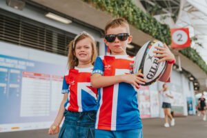 Kids try touch rugby activities at the fan engagement zones. [photo credit: The Kallang Group]