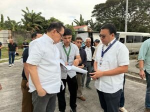 SHFC President Federico Laxa and DHSUD Secretary Jose Ramon Aliling review construction progress in Caloocan City’s HDH project.