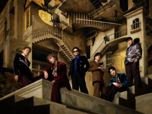 The members of GENERATIONS appear in a group portrait as their back catalog returns to Japan’s music charts.