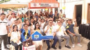 Officials from DHSUD and SHFC lead the turnover ceremony for beneficiaries of the Mapalad Ka Homeowners’ Association.