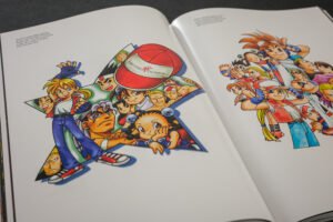 Archival concept art and promotional illustrations from SNK are featured throughout the publication.
