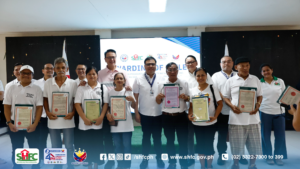 SHFC and DHSUD officials during the title-awarding ceremony.